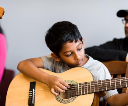 Boy playing guitar